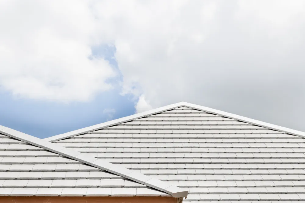 Tile roof and sky with clouds