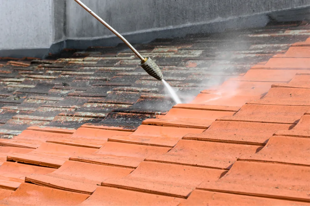 high pressure hose cleaning and restoring a tile roof