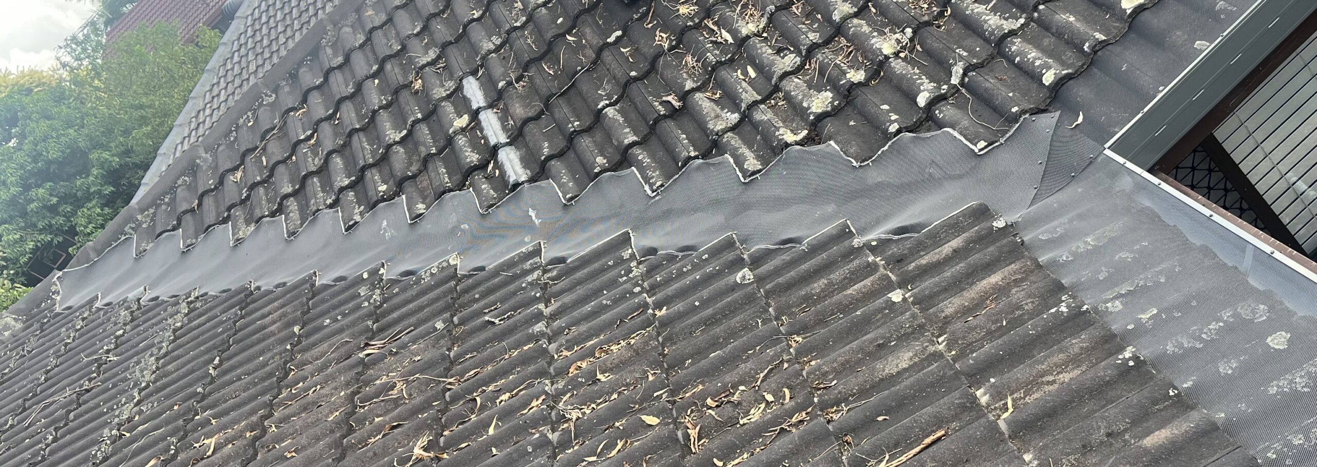 Gutter Guard installed on tile roof by Gutter and Roof Repairs
