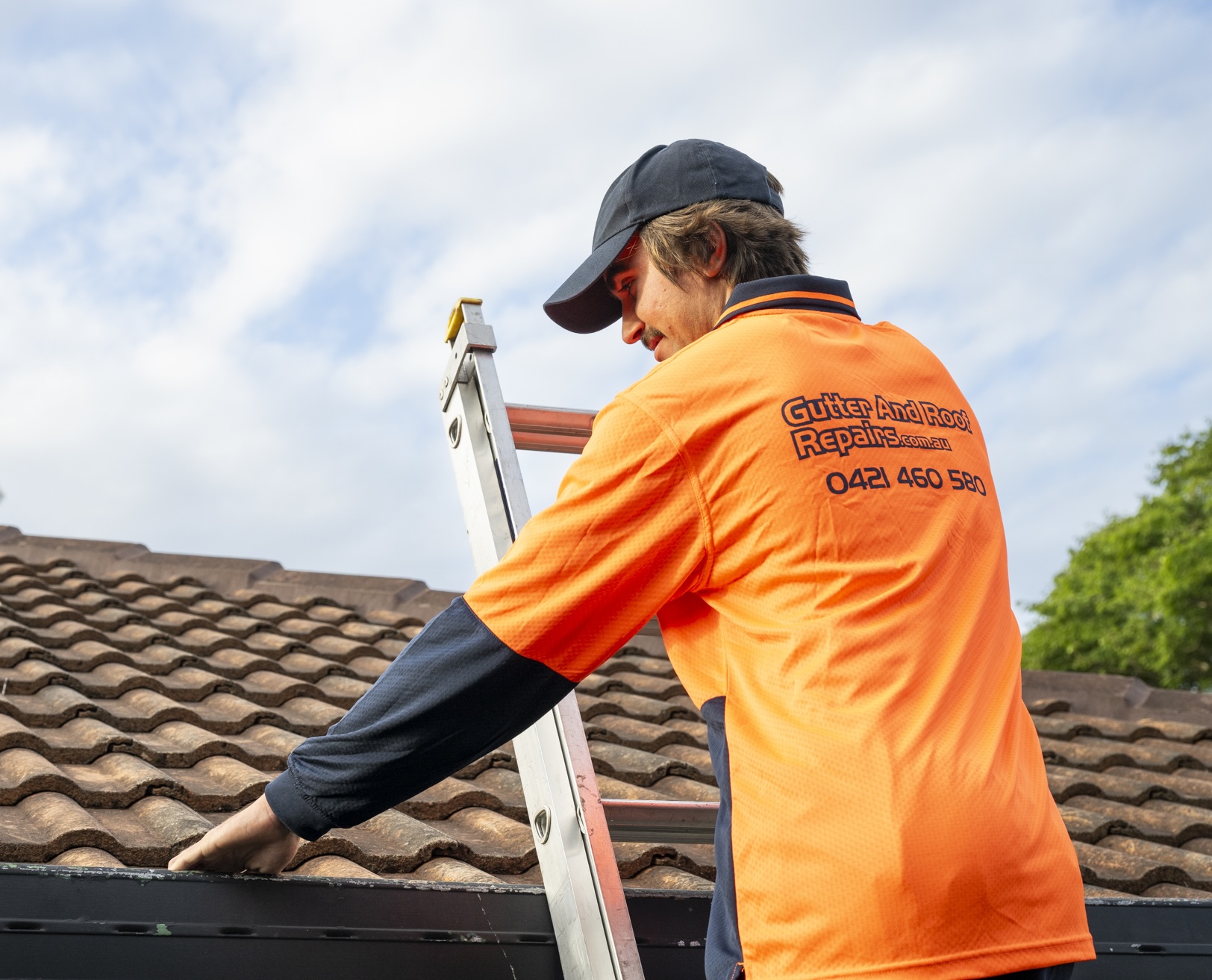Gutter and Roof Repairs roofer completing roof inspection
